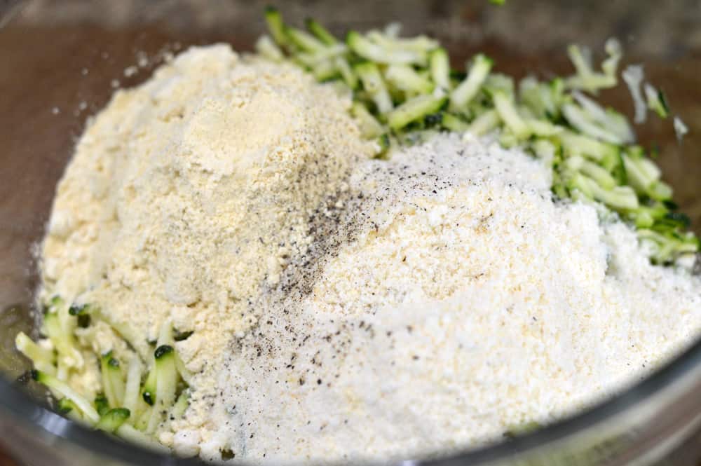 Add dry ingredients to shredded zucchini
