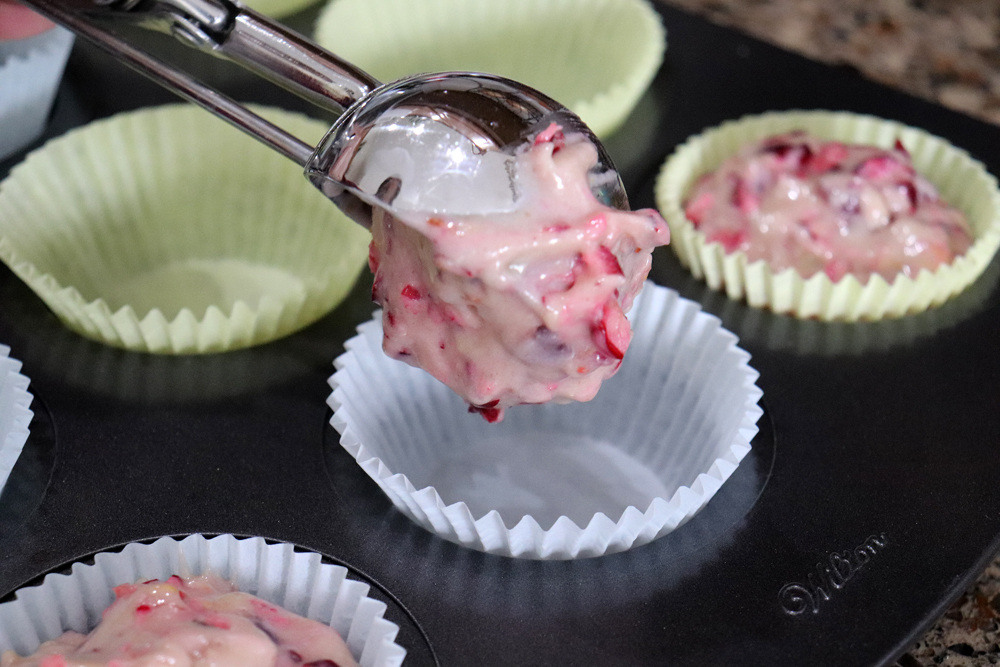 Scooping batter into muffin cups