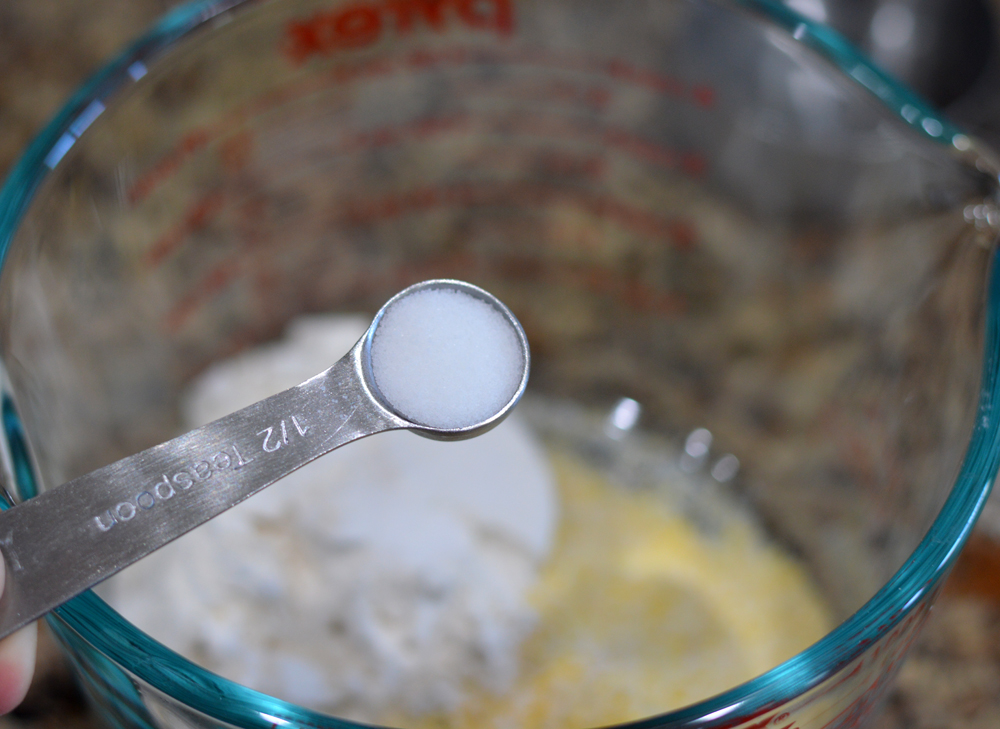Measuring spoon full of salt for Vegan Corn Fritters