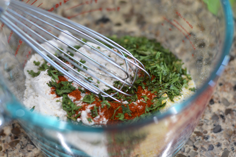 Whisking dry ingredients for Vegan Corn Fritters