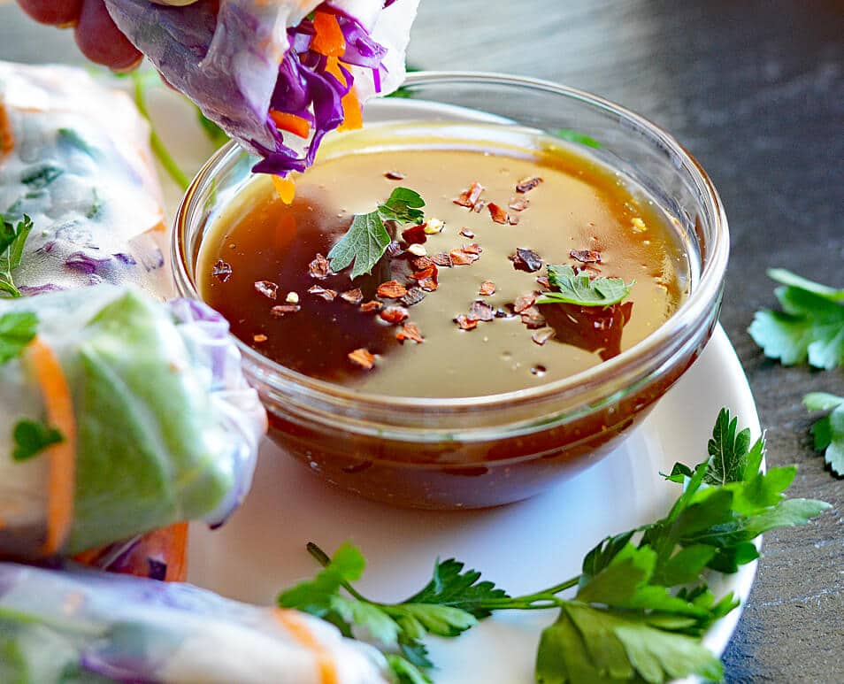 Dipping the Vegetable Spring Rolls with Peach Ginger Dipping Sauce