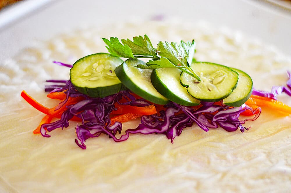 Layering ingredients for Vegetable Spring Rolls with Peach Dipping Sauce