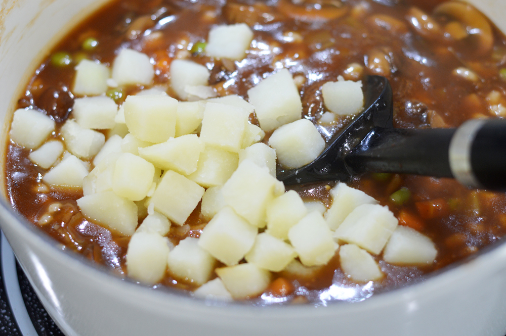 Adding potatoes to the Vegan Mushroom Barley Soup