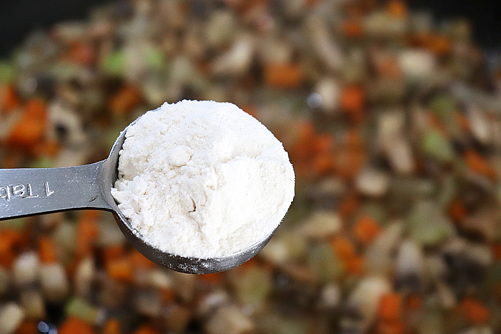 Adding 2 tablespoons of flour to sauteed vegetables