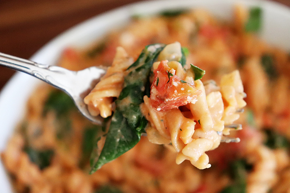 Bite shot of Gluten Free Rotini in a Tomato Cream Sauce