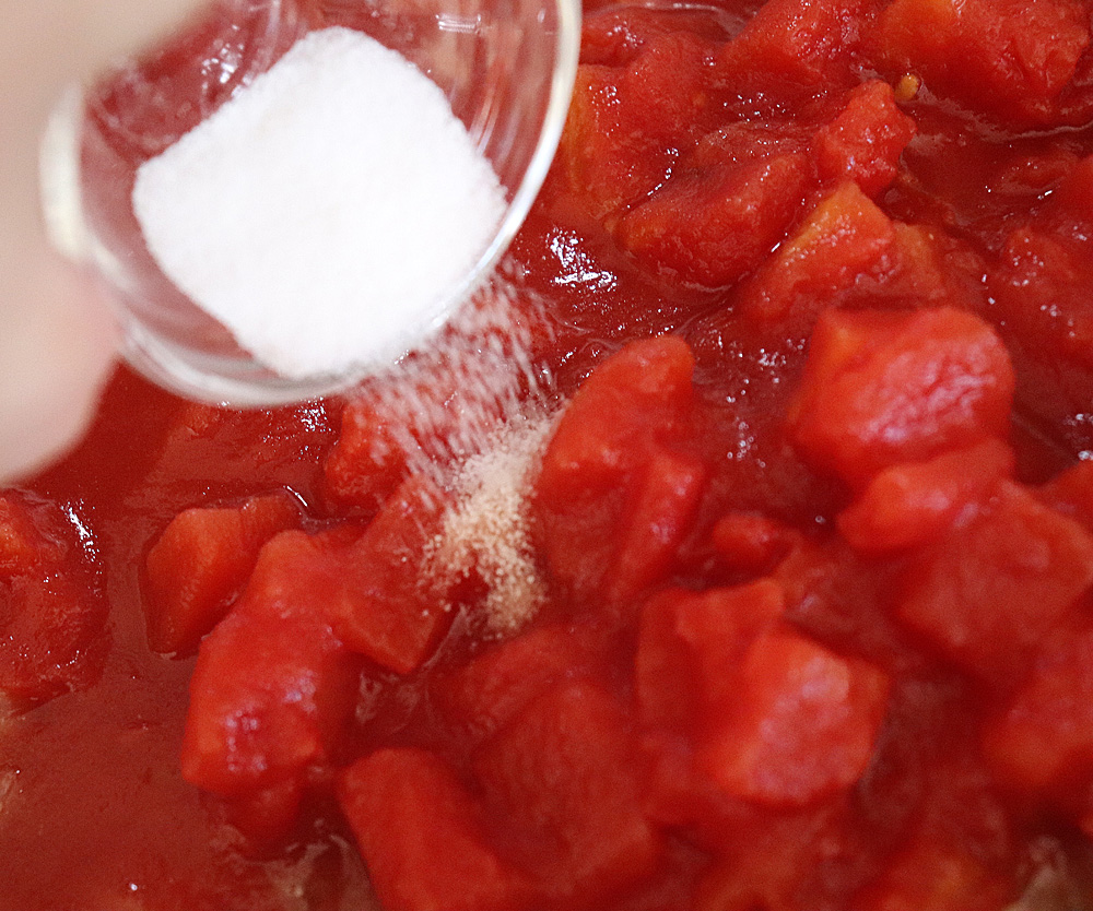 Adding salt to diced tomatoes