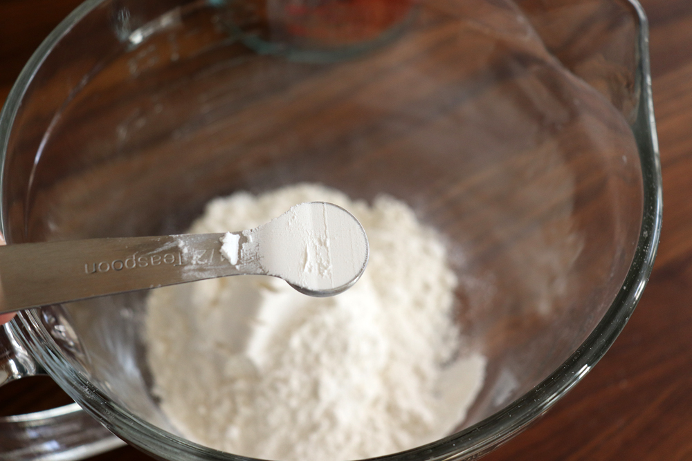 Adding baking powder to the flour mixture for Easy Vegan Brownies