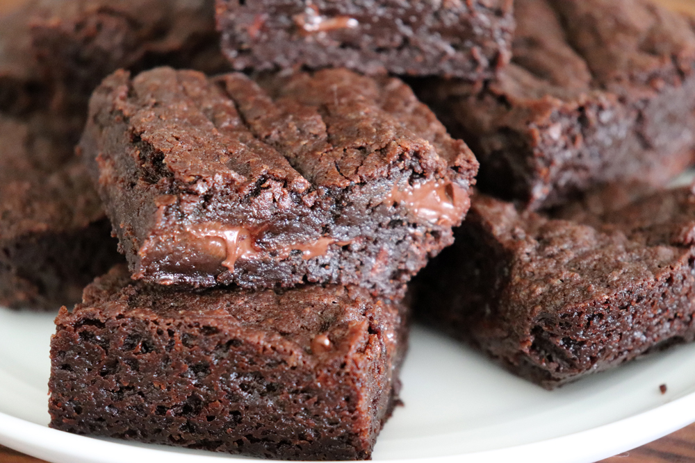 Cut brownies on a plate for Easy Vegan Brownies