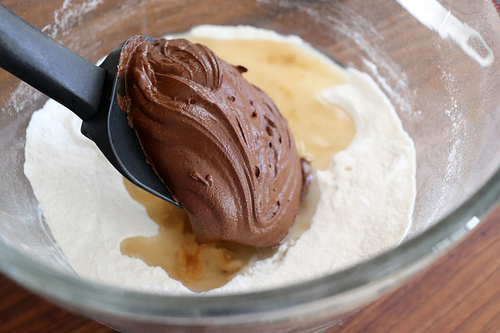 Adding the chocolate mixture to the flour mixture for Easy Vegan Brownies