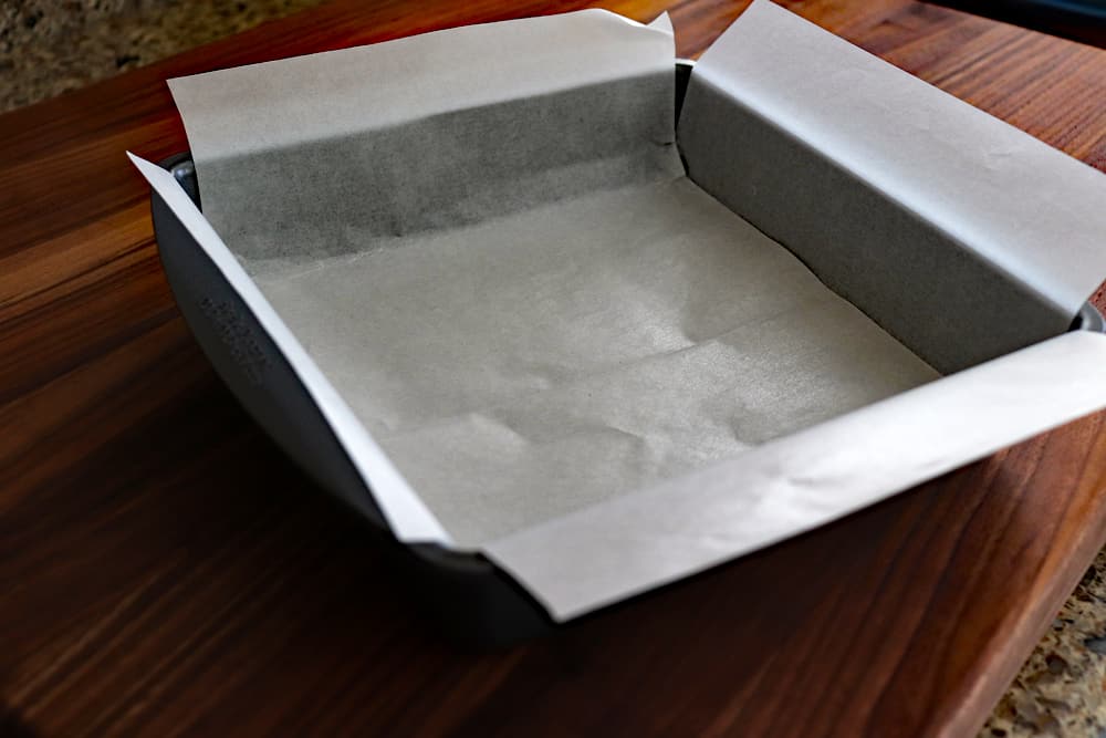Parchment lined 8x8 pan for Easy Vegan Brownies
