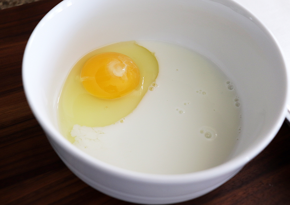 Egg and milk in a bowl for Crispy Baked Avocado Fries