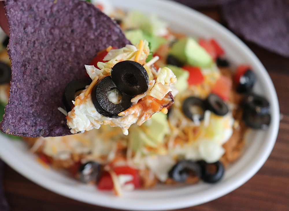 Bite from Easy Seven Layer Bean Dip