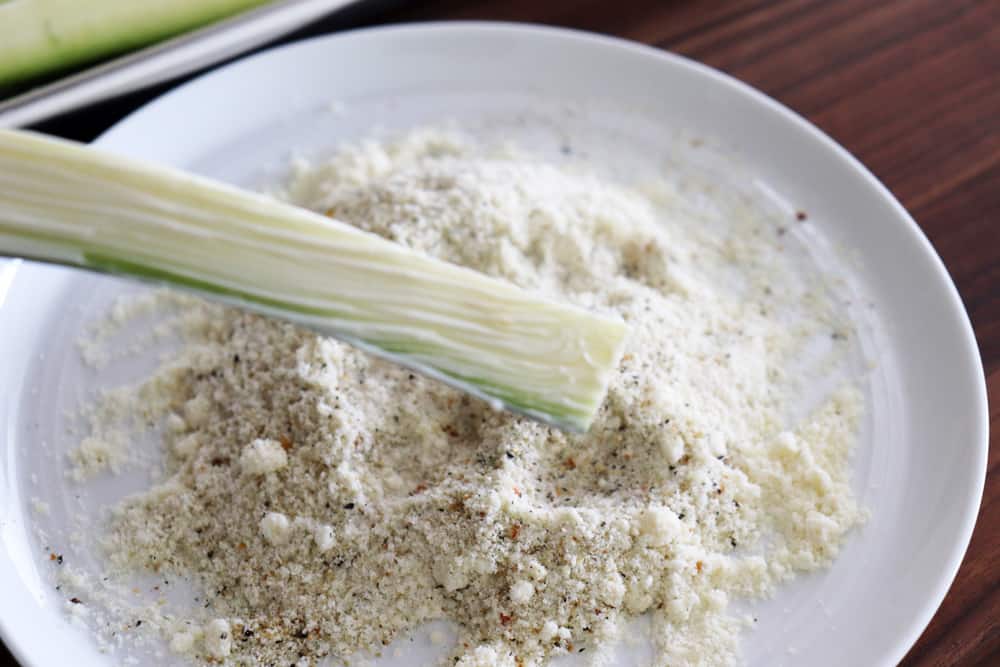 brushing mayonnaise on zucchini