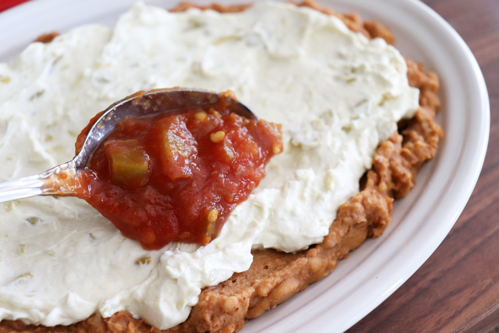 Adding salsa to the cream cheese layer