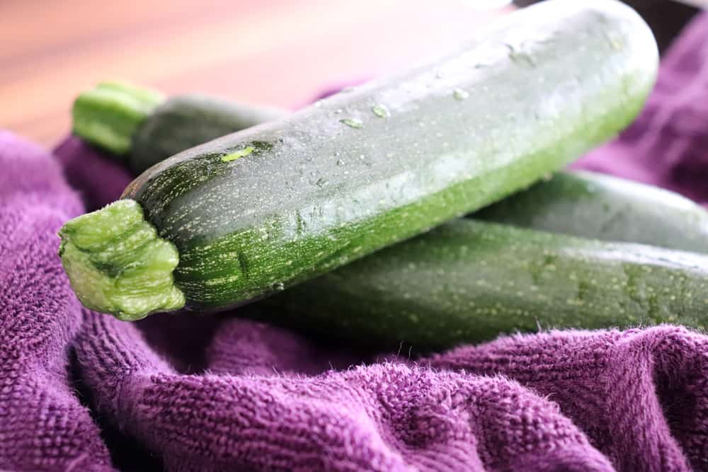 zucchini on a purple towel