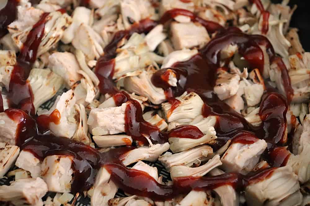 Adding Barbecue sauce to the jackfruit