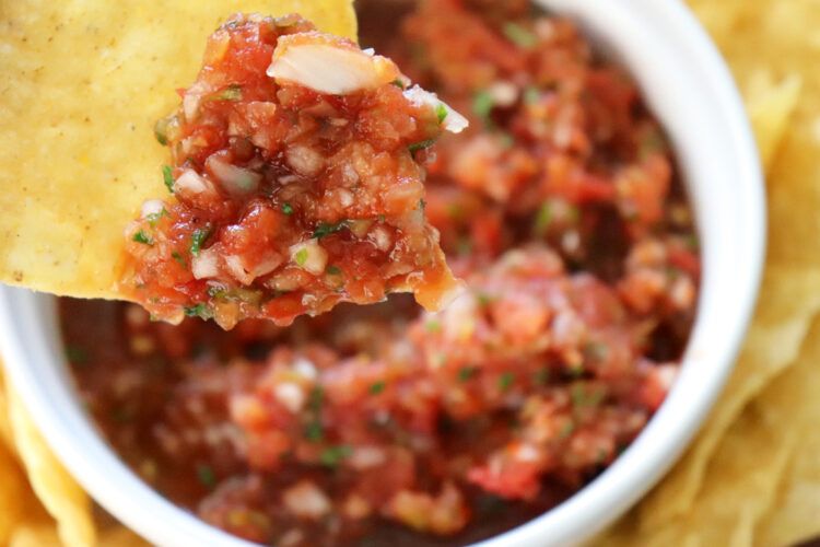 Chip Dipped into blender salsa