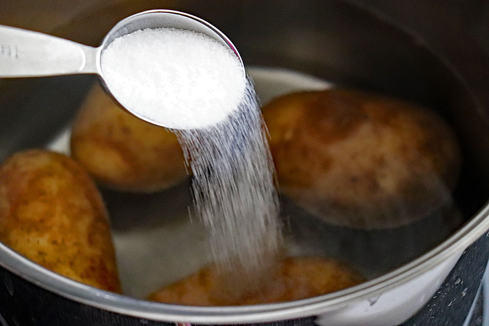 Boiling potatoes in a pot of salted water