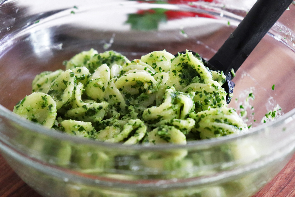 Tossing the pasta and pesto