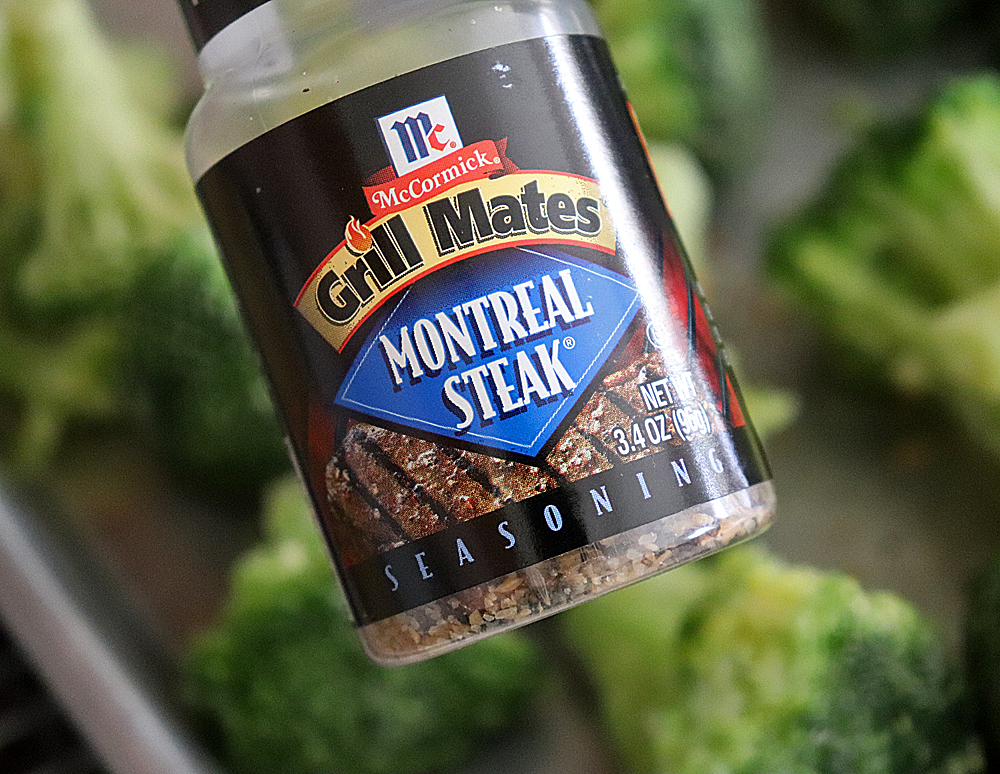 Adding Montreal Seasoning to the broccoli