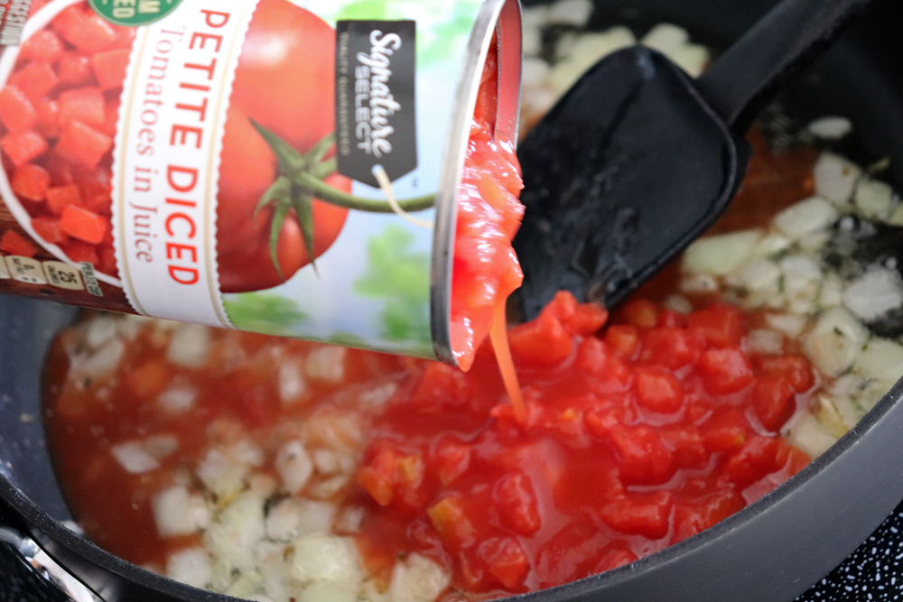 Adding diced tomatoes