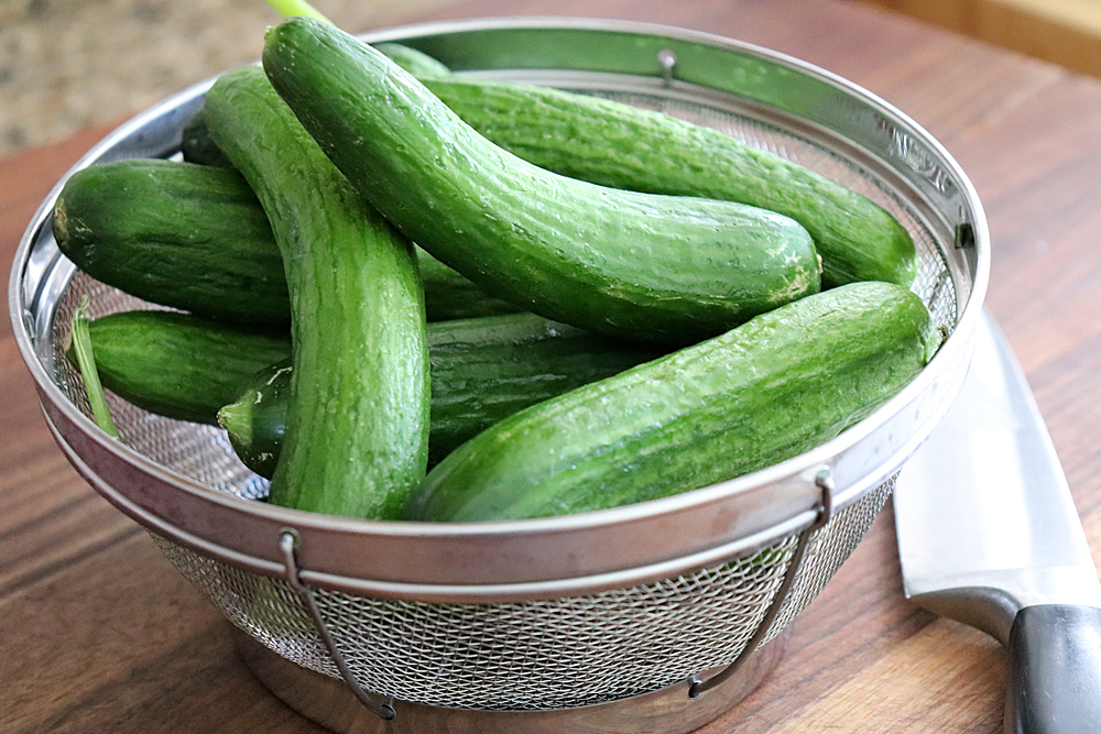 strainer full of cucumbers