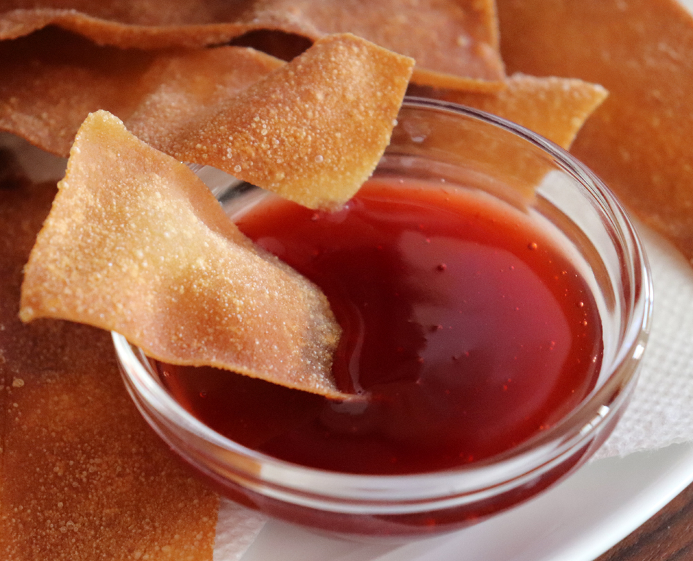 Dipping the wontons in sweet and sour sauce